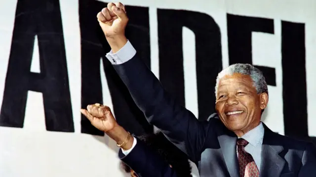 March 17, 1990 anti-apartheid leader and African National Congress (ANC) member Nelson Mandela raises clenched fist, arriving at the "human rainbow" music concert organised by local artists to celebrate ANC leader"s release from 27 years of imprisonment last 11 February, at Ellis Park stadium in Johannesburg. - December 5, 2018, marks the fifth anniversary of the death of Nelson Mandela (July 18, 1918 - December 5, 2013), South Africa"s first black president (1994-1999) and an anti-apartheid revolutionary and peace activist. Mandela spent 27 years in prison for political offences under the apartheid-era all-white South African regime. After being released in 1990, he led the country"s transformation into a multi-racial democracy.