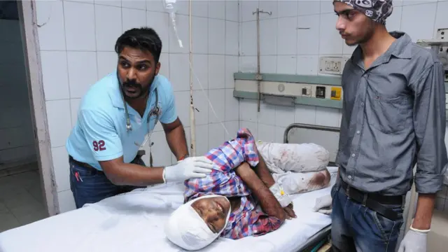 A person who was injured in the train accident undergoes treatment at a hospital in Amritsar, India, 19 October 2018.
