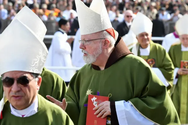 Cardinal Sean O'Malley (C) attends the Mass celebrated by Pope Francis at the Las Palmas air base in Lima, 21 January 2018