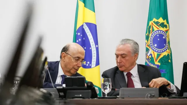 O Ministro da Fazenda, Henrique Meirelles, e Temer;ganhar na bet365seis meses, indicadores econômicos têm sido erráticos