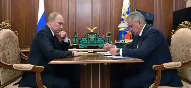 Russian President Vladimir Putin and Defence Minister Sergei Shoigu