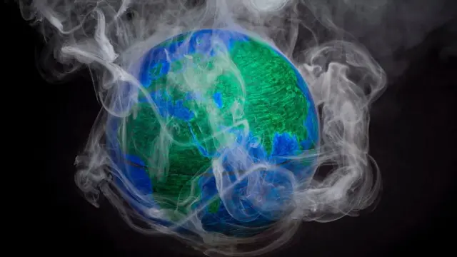 Model of the Earth with smoke coming off it