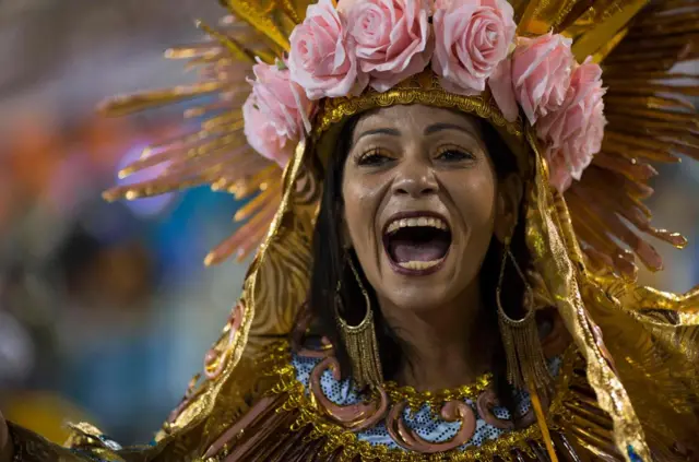 A reveller of the Beija-Flor samba school performs during the second night of Rio"s Carnival at the Sambadrome in Rio de Janeiro, Brazil, on February 13, 2018. / AFP PHOTO / Mauro PIMENTELMAURO PIMENTEL/AFP/Getty Images