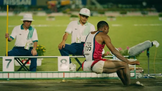 Mike Powell of the United State making his world record leap during the Long Jump event at the IAAF World Athletic Championships on 30th August 1991 at the Olympic Stadium in Tokyo, Japan