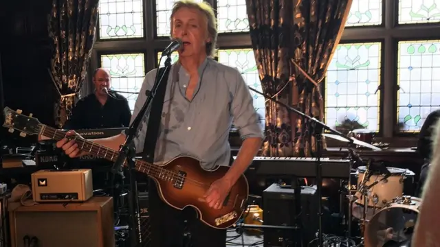 Sir Paul McCartney plays Beatles and Wings hits to pub crowd