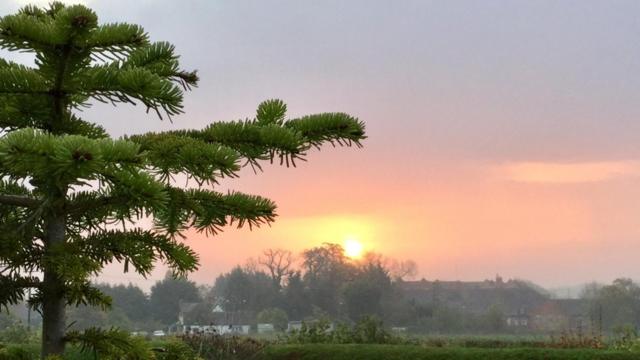 Skies over parts of UK turn 'fiery' red in rare sunset phenomenon