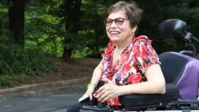 Judy in a wheelchair