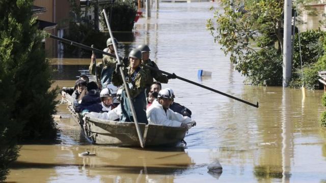 Soldiers use boats to rescue residents hit by floods in Japan