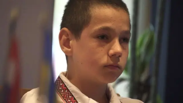 Sasha looks pensive as he talks about his experience