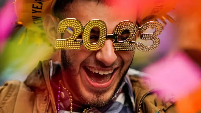 A man wearing novelty 2023 glasses