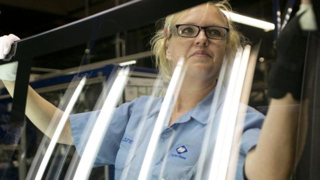 Lauren Hartley cleans and inspects glass at Fuyao Glass in Moraine, Ohio on September 29, 2016