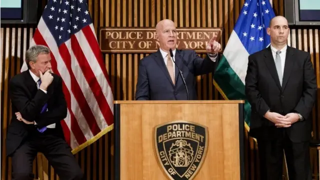 New York Police Commissioner James O'Neill (centre), New York Mayor Bill de Blasio (left) and FBI Assistant Director William Sweeney (right) brief reporters