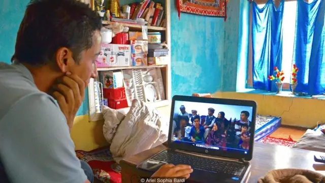 Without internet, estranged family members exchange video messages on flash drives, sent by post