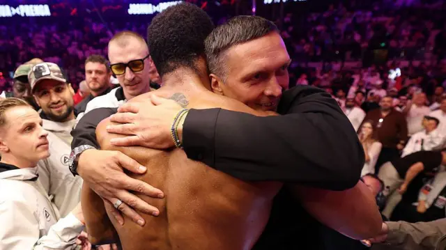 Oleksandr Usyk hugs Anthony Joshua after the fight