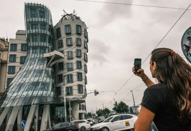 A view of the Dancing House is a deconstructive building by Nationale-Nederlanden, designed by Croatian-Czech architect Vlado Meloni in collaboration with Frank Gehry and facing the Vltava River in Prague, Czech Republic, on August 5, 2022. (Photo by Oscar González/Noor Photo via Getty Images)