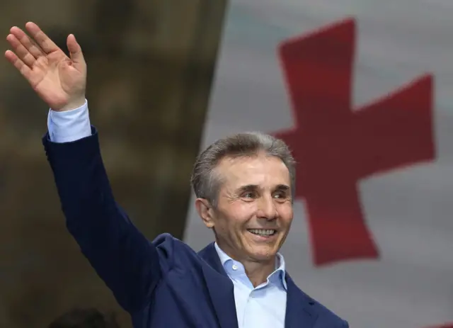 Bidzina Ivanishvili waves at a pro-government rally