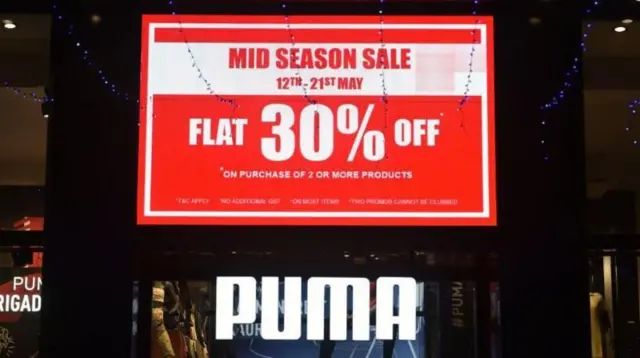 મે 2023માં બૅંગલુરુની દુકાનનું એક બોર્ડ