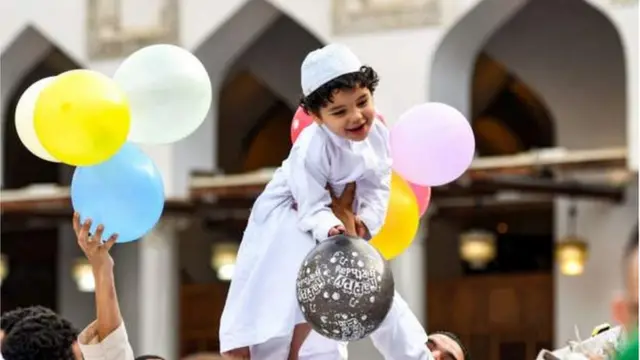 One small boy hold balloons