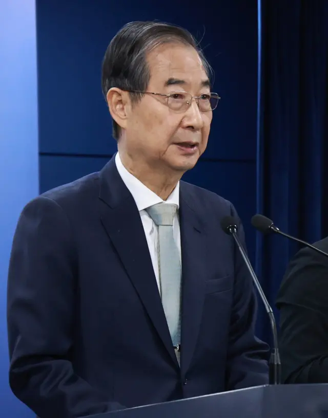 Mandatory Credit: Photo by YONHAP/EPA-EFE/REX/Shutterstock (15237432i)
Acting President and Prime Minister Han Duck-soo attends a press conference at the government complex in Seoul, South Korea, 04 April 2025, to deliver a televised address to the nation after the Constitutional Court upheld the impeachment of President Yoon Suk Yeol, removing him from office over his brief imposition of martial law in December.
Constitutional Court upholds Yoon's impeachment, Seoul, Korea - 04 Apr 2025