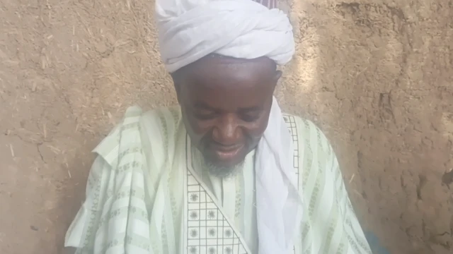 Local chief of Gorau community, wear dia native dress and a traditional head scarf