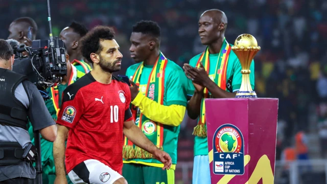dejected salah takes his losers medal after Senegal defeated them on penalties at the 2021 afcon final