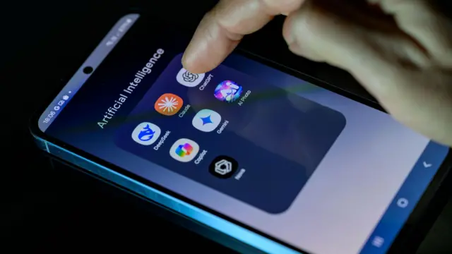 The words "artificial intelligence" are displayed on the mobile phone screen