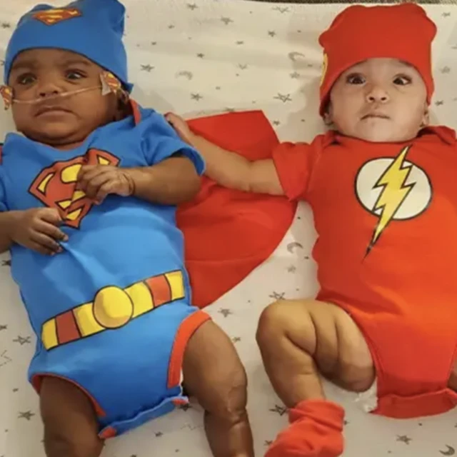 Di kids wear superhero costumes