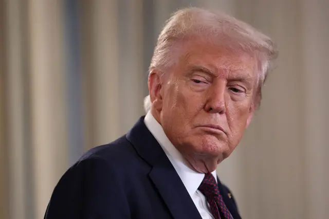 Close up of Donald Trump face as e turn look back