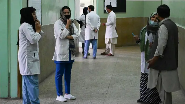 Doctors and paramedical staff chat among themselves at Wazir Akbar Khan hospital in Kabul on 1 September 2021