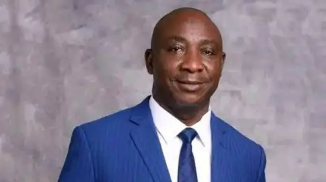 Ibrahim Gusau NFF President wearing blue suit and white shirt