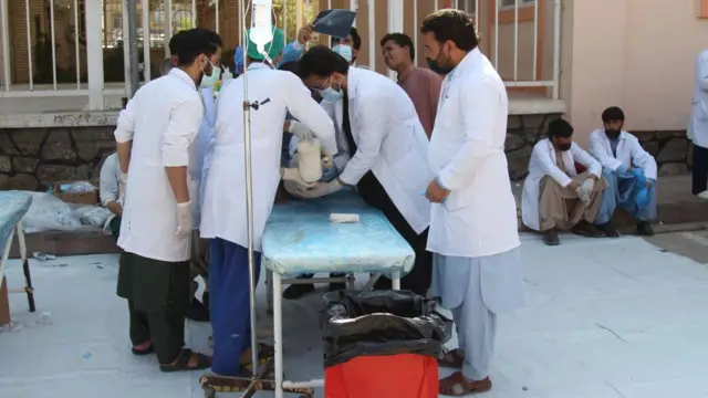 Medics help a victim of the earthquake outside the only state-run hospital in the region hit by earthquakes