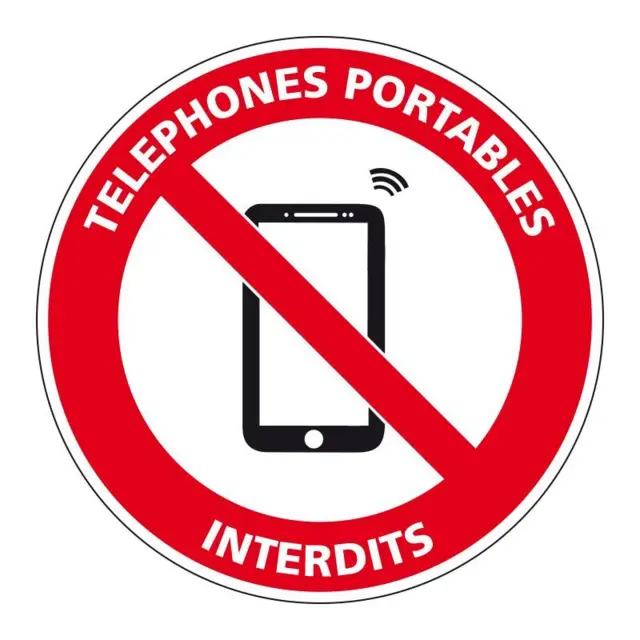 Panneau vectoriel rouge sur fond blanc avec la mention téléphones portables interdits