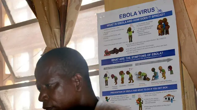 Informations and instructionson Ebola virus dey on di wall for one local hospital in Buchanan, Liberia.