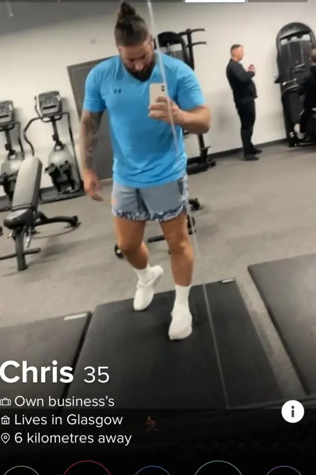 Christopher Harkins' tinder profile photo. It shows Harkins on a treadmill in a gym. He is taking a mirror selfie. He is dressed in a blue t-shirt, cut-off denim shorts and white trainers with white socks. He has a sleeve tattoo on one arm.