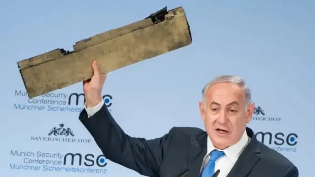 Former Israeli Prime Minister Benjamin Netanyahu displays the remains of an Iranian drone, which he says was shot down over Israeli territory. February 2018