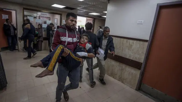 Wounded people, including children, are brought to Al-Aqsa Martyrs Hospital for treatment following Israeli attacks in Deir al-Balah, Gaza on 4 January 2024