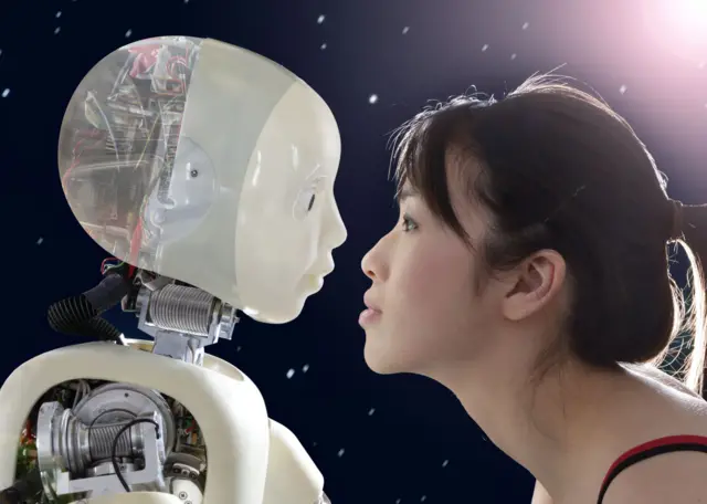 Woman and robot face to face - stock photo