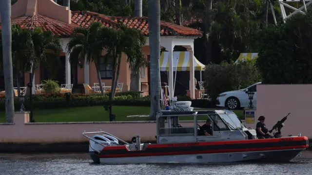 A U.S. Coast Guard boat patrols outside U.S. President-elect Donald Trump’s residence at Mar-A-Lago