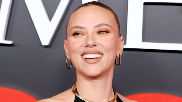 Scarlett Johansson smiling on a red carpet