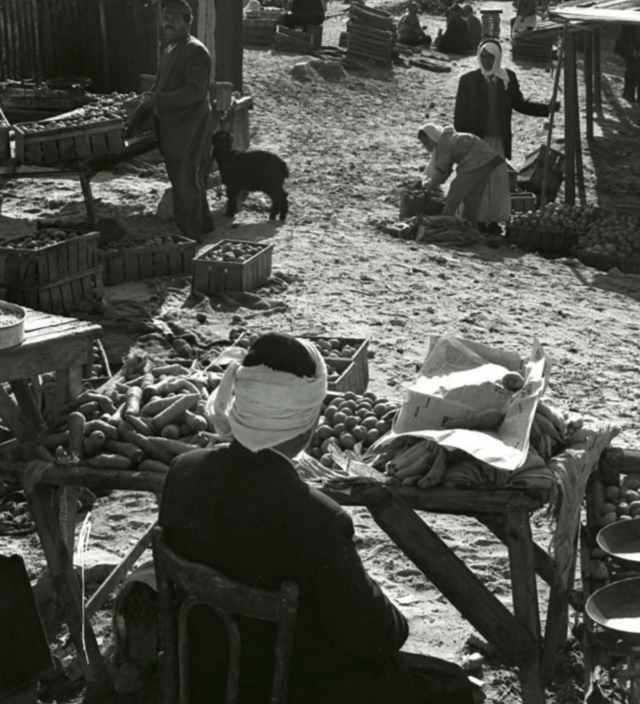 Palestinian refugees shop in the old Arab market in Rafah in 1975