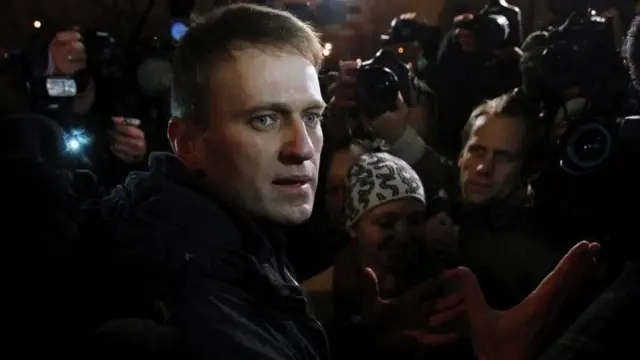 Alexei Navalny standing in front of reporters in public