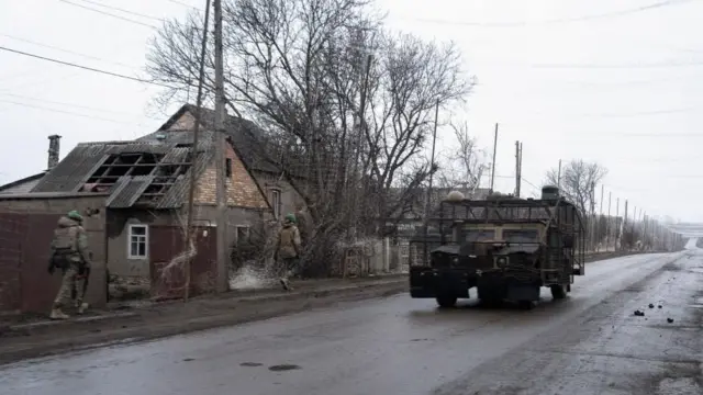 A US-made High Mobility Multipurpose Wheeled Vehicle (HMMWV; Humvee) outfitted with an anti-drone armor navigates a road at an undisclosed location in the Donetsk region, eastern Ukraine, on 6 March 2026.