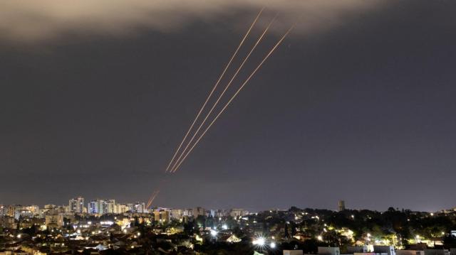 An anti-missile system operates after Iran launched drones and missiles towards Israel, as seen from Ashkelon, Israel 14 April 2024