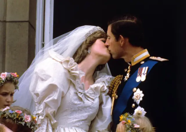 The newly married Prince and Princess of Wales kissed on the balcony of Buckingham Palace after their wedding ceremony at St. Paul's cathedral.