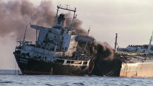 The Greek registered-tanker Adriande billowing smoke just after she was attacked by Iranians off the coast of Dubai for the second time in one day on 15 December 1987