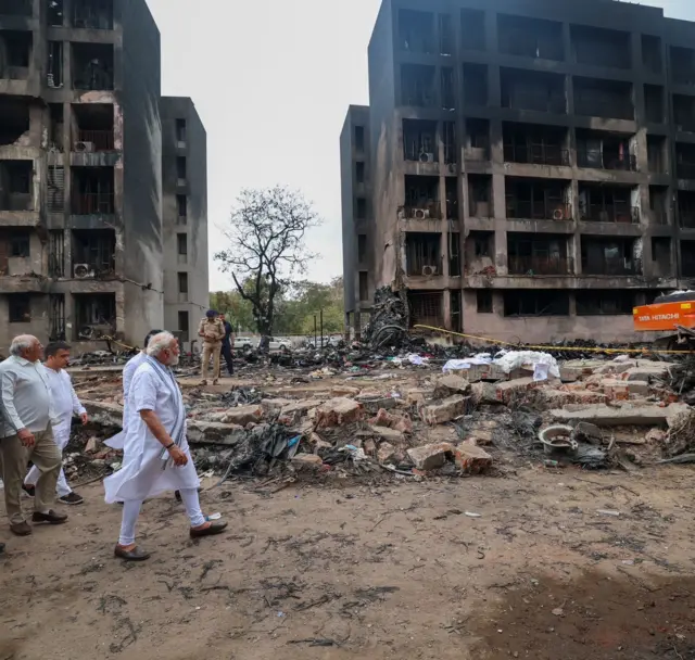 Indian PM Narendra Modi visits the crash site.