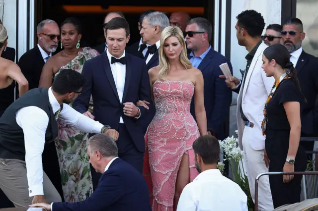 Ivanka Trump and her husband Jared Kushner in Venice, Italy, for di wedding of Jeff Bezos and Lauren Sanchez. Ivanka wear pink dress and Jared wear suit and bow tie.