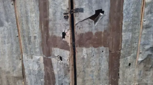 Alamar sara da adda kan wani shago na langa-langa a unguwar Kofar Mata