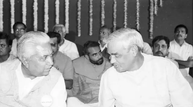 Vajpayee at a function in Gujarat in 1994. Behind him, sitting, is Narendra Modi, now the Indian PM