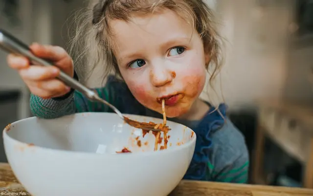 Girl eating spaghetti